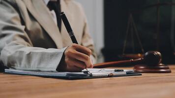 Lawyer writing on paper with pen and notepad video