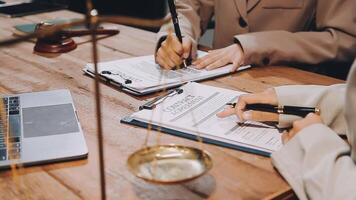 A lawyer and a client at a desk video