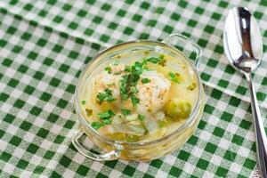Diet chicken soup with vegetables in a plate for lunch photo