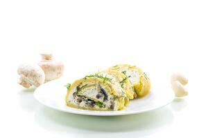 Organic homemade recipe. baked potato roll with cottage cheese filling with garlic and mushrooms, isolated on white background photo
