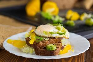 Toast with egg and fresh vegetables .Side view. photo