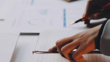 A person is writing on a notebook with a pen video