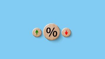 Financial, stocks, interest rate and GDP percent change, wooden block with percentage sign and arrow up sign and down for interest rate, ranking, gdp. photo