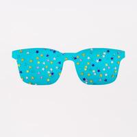 Colorful glitter stars confetti on bright blue background visible through white glasses shaped cutout. Minimal party concept. Trendy celebration backdrop idea. Festive holiday flat lay, top view. photo