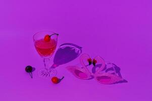 Summer cocktail with cherry fruit and pink flamingo party glasses in vibrant bold gradient holographic neon colors. Minimal surreal concept. Retro futurism. photo