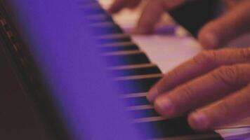 A close up of a person's hands playing the piano video