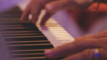 A close up of a person playing the piano video