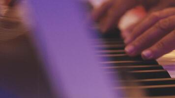 A close up of a person's hands playing the piano video