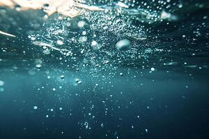 Underwater view of air bubbles rising to the surface photo