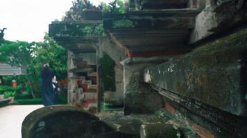 Ancient Balinese Architecture with Figures in Conversation video