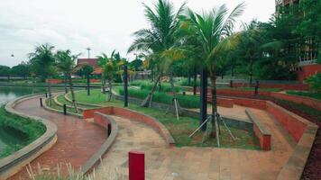 Tranquil Park Landscape with Winding Pathways and Palm Trees video