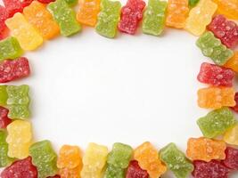A background frame formed from a bunch of colorful sour gummy bears photo