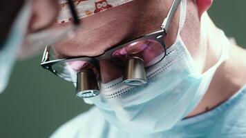 Surgeon performing surgery on patient in hospital operating room. Urgent treatment, plastic surgery. Specialists saving patient life in operation theater video
