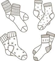 A set of hand-drawn illustrations of warm socks with patterns. Knitted wool clothes. Outlines of clothing items. vector