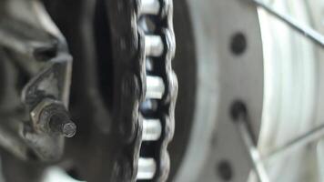 Details of the motorcycle chain and wheels show off the precision in the engine's movements video
