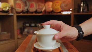 A serene shows beverage preparation on a rustic table. Media video