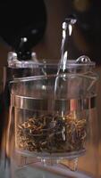An Elegant Glass Container featuring Dried Herbs along with a builtin Infuser for convenience. Media video