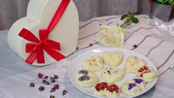 Delicious chocolate sweets with floral design in a romantic setting video