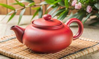 A traditional Chinese clay teapot is on the table photo