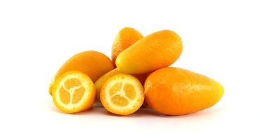 Fresh Kumquats and Sliced Halves Displayed Against a White Background photo