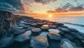 hexagonal basalt volcanic rock on geological formation in ocean photo