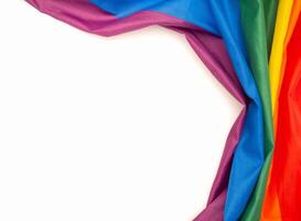 The rainbow flag is on a white background with copy space for text photo