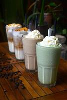 Coffee beverages on the wooden table in a coffee shop photo