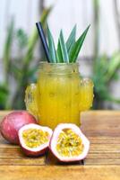 Passion Fruit tea on the wooden table closeup photo