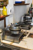 Waffle iron machine on the table in the cafe kitchen photo