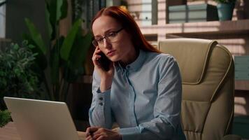 Caucasian multitasking business woman busy stressful entrepreneur busy employee overworked angry businesswoman girl talk mobile phone nervous deadline write notes smartphone call laptop work in office video