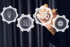 Businessman using a pen to select SEO work management. photo