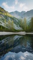 Stunning mountain landscape reflected in a serene lake surrounded by lush trees. photo