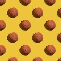Lychee fruits on yellow background, lychee pattern photo