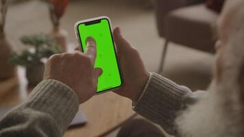 Elderly Man Swipe Twice on Chroma Key Smartphone video
