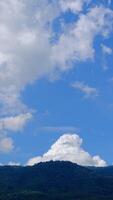 Calming beauty of fluffy clouds gliding through a clear, sunny sky. video