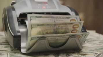 Cash Counting Machine with Stacks of Dollar Bills video