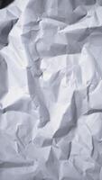 Torn white paper vertical background White crumpled sheet stop motion seamless loop video