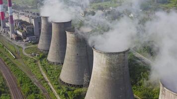 Aerial view of the pipes of a coal power plant and cooling tower video