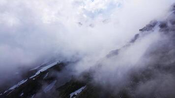 Aerial. The cableway on the slope of Mount Elbrus in the clouds at dawn video