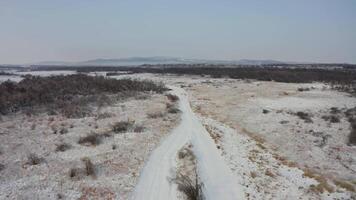 View from a drone to the ground covered with ice at the morning video
