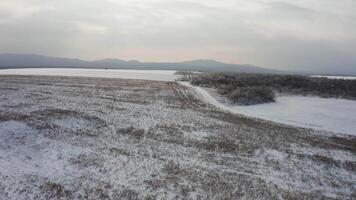Close-up view from a drone to the ground covered with ice at the morning video