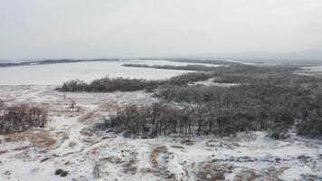 View from a drone to the ground covered with ice at the morning video