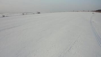 View from a drone to the ground covered with snow video