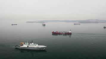 Aerial view of the a container vessel and rescue ship in motion video