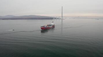 Drone view of the a pilot boat and container vessel in motion video