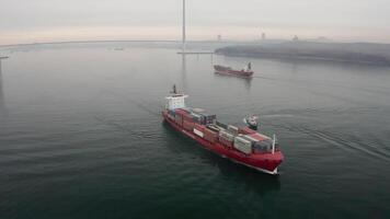 Drone view of the a pilot boat and two container ship in motion video