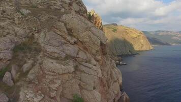 Drone view of the steep cliffs and the remains of a destroyed fortress video