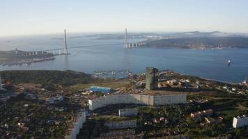 View of the Russian bridge across the strait. A modern building with reflections video