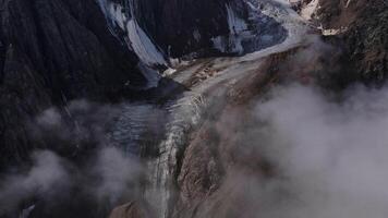 The view from the air is a beautiful glacier descending into the valley video