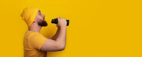 man with binoculars panoramic photo